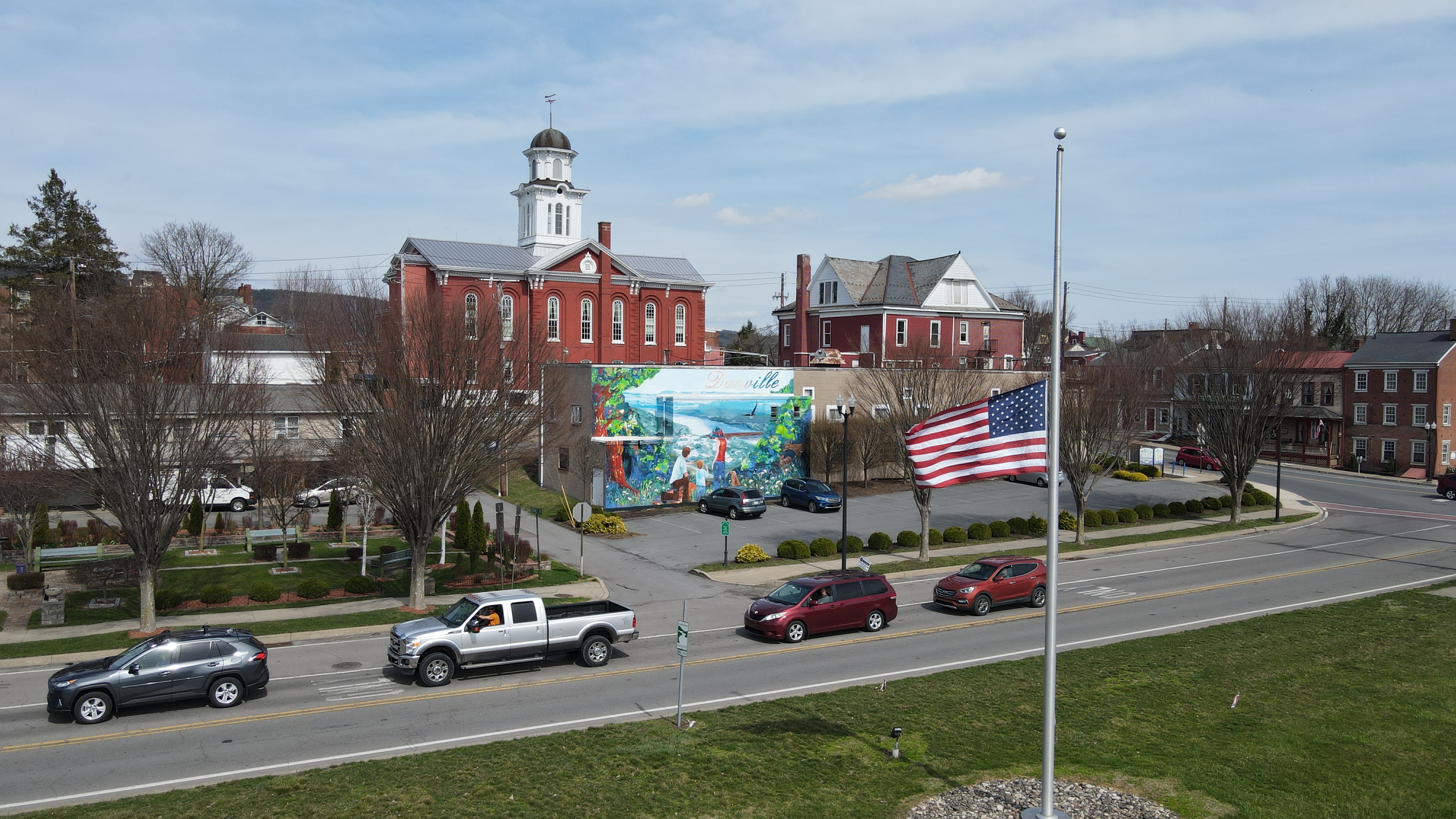 Drone photo of mural on building.